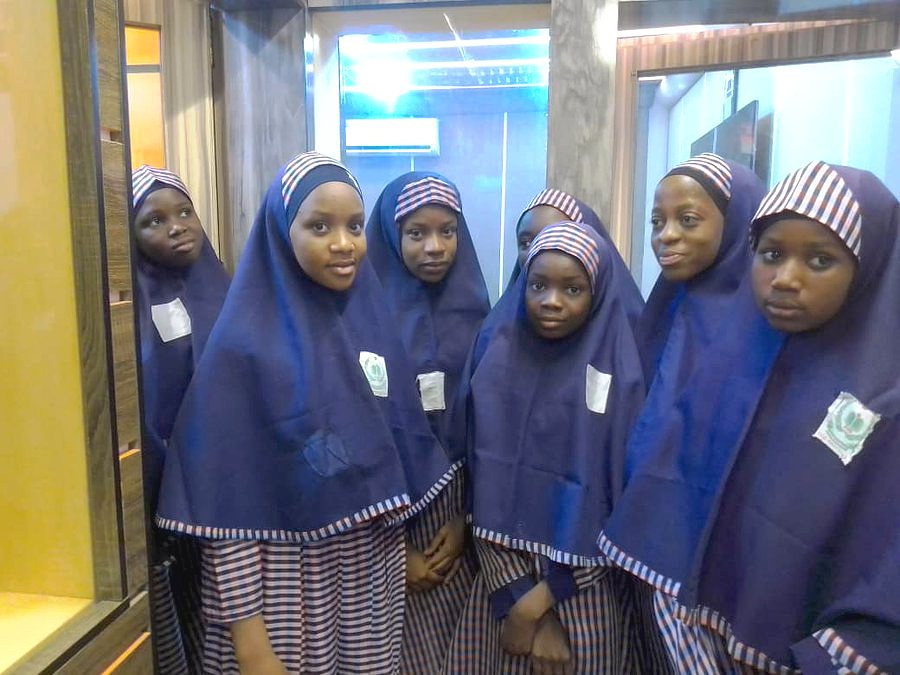 Pupils of the school in uniform: navy hijab with striped trim